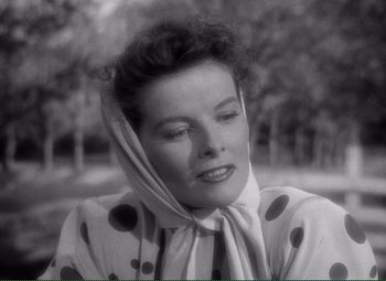 Movie still from “Without Love” (1945), directed by Harold S. Bucquet – An old black and white photo of a woman wearing a polka dot dress; Close Up shot, Low angle