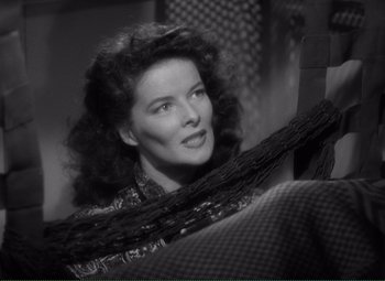 Movie still from “Without Love” (1945), directed by Harold S. Bucquet – An old black and white photo of a woman sitting on a chair; Close Up shot, High angle