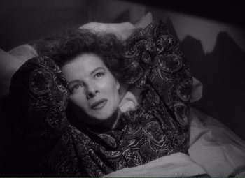Movie still from “Without Love” (1945), directed by Harold S. Bucquet – A woman laying in a bed with her eyes closed; Close Up shot, Overhead angle