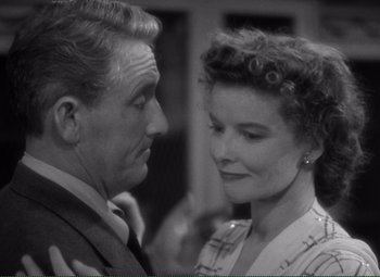 Movie still from “Without Love” (1945), directed by Harold S. Bucquet – An older man standing next to an older woman; Close Up shot, High angle