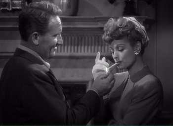 Movie still from “Without Love” (1945), directed by Harold S. Bucquet – A man and a woman are looking at each other; Medium shot, Over the shoulder angle