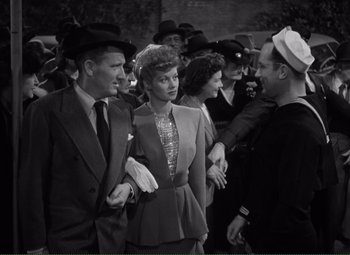 Movie still from “Without Love” (1945), directed by Harold S. Bucquet – A group of people standing next to each other in a crowd; Medium shot, High angle