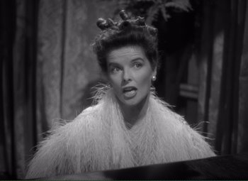 Movie still from “Without Love” (1945), directed by Harold S. Bucquet – An old photo of a woman in a fur coat; Close Up shot, High angle