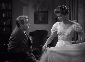 Movie still from “Without Love” (1945), directed by Harold S. Bucquet – A man and a woman in a room with a table; Medium shot, Low angle