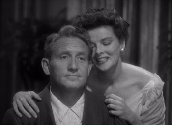 Movie still from “Without Love” (1945), directed by Harold S. Bucquet – An old photo of a man and a woman posing for a picture; Close Up shot, High angle