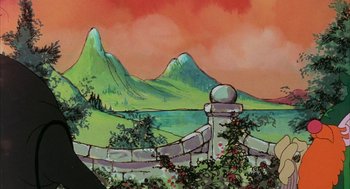 Movie still from “Wizards” (1977), directed by Ralph Bakshi – A painting of mountains and a fence with bushes growing around it; Wide shot, Low angle