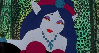 Movie still from “Wizards” (1977), directed by Ralph Bakshi – A woman with long blue hair wearing a red and blue headpiece; Close Up shot, Low angle