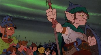 Movie still from “Wizards” (1977), directed by Ralph Bakshi – An animated picture of a man holding a sword in front of a group of people; Medium shot, Low angle