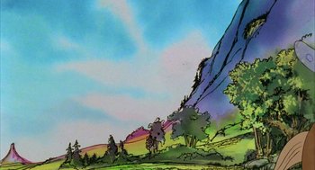 Movie still from “Wizards” (1977), directed by Ralph Bakshi – A painting of a mountain with trees in the background; Extreme Wide shot, Low angle