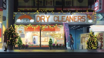 Movie still from “Wolf Children” (2012), directed by Mamoru Hosoda – A woman standing in front of a dry cleaner store; Extreme Wide shot, High angle