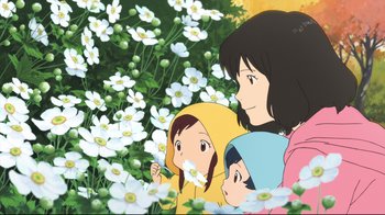 Movie still from “Wolf Children” (2012), directed by Mamoru Hosoda – A woman and two children in a field of flowers; Medium shot, Low angle