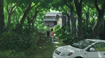 Movie still from “Wolf Children” (2012), directed by Mamoru Hosoda – Two people walking down a path in the woods; Extreme Wide shot, Low angle