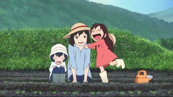 Movie still from “Wolf Children” (2012), directed by Mamoru Hosoda – A group of people standing next to each other on top of a field; Wide shot, High angle
