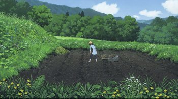 Movie still from “Wolf Children” (2012), directed by Mamoru Hosoda – A person in a field with a plow in front of a hill; Extreme Wide shot, High angle