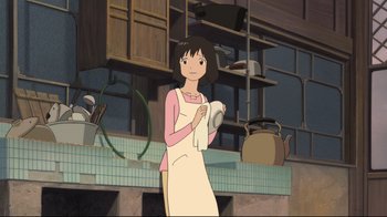 Movie still from “Wolf Children” (2012), directed by Mamoru Hosoda – A woman holding a towel in a kitchen; Medium shot, Low angle
