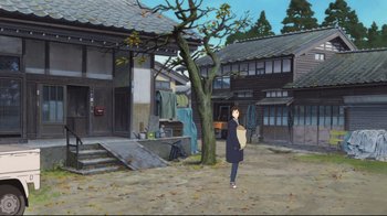 Movie still from “Wolf Children” (2012), directed by Mamoru Hosoda – A person standing in front of a tree holding a bag; Extreme Wide shot, High angle