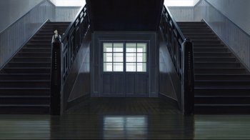 Movie still from “Wolf Children” (2012), directed by Mamoru Hosoda – A dark room with stairs leading up to a window; Extreme Wide shot, High angle