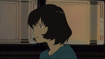 Movie still from “Wolf Children” (2012), directed by Mamoru Hosoda – A woman with short black hair is looking to her left; Close Up shot, Over the shoulder angle