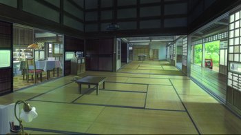 Movie still from “Wolf Children” (2012), directed by Mamoru Hosoda – An empty room that has a table in the middle of the floor; Extreme Wide shot, High angle