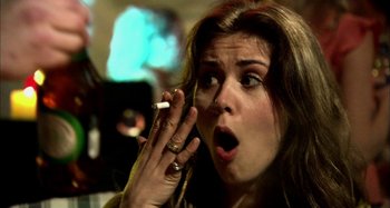 Movie still from “Wolf Creek” (2005), directed by Greg McLean – A person talking on a cell phone; Close Up shot, Over the shoulder angle