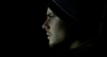 Movie still from “Wolf Creek” (2005), directed by Greg McLean – A person wearing a hat; Close Up shot, Low angle