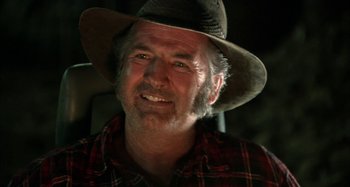 Movie still from “Wolf Creek” (2005), directed by Greg McLean – A person wearing a hat; Close Up shot, Low angle