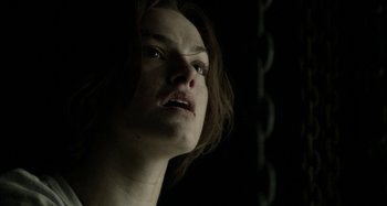 Movie still from “Wolf Creek” (2005), directed by Greg McLean – A person looking at the camera; Close Up shot, Low angle