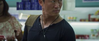 Movie still from “Wolf Warrior 2” (2017), directed by Jing Wu – A person wearing a necklace; Close Up shot, Over the shoulder angle