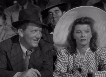 Movie still from “Woman of the Year” (1942), directed by George Stevens – A black and white photo of a man and a woman; Medium shot, Low angle