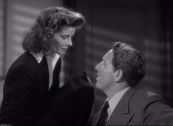 Movie still from “Woman of the Year” (1942), directed by George Stevens – A man and a woman are looking at each other; Medium shot, Low angle