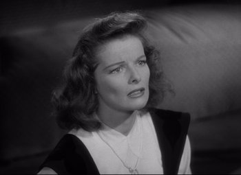 Movie still from “Woman of the Year” (1942), directed by George Stevens – An old photo of a woman in a black and white photo; Close Up shot, High angle