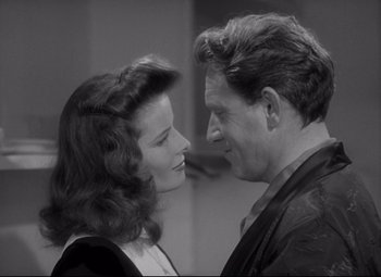 Movie still from “Woman of the Year” (1942), directed by George Stevens – A man and a woman looking at one another; Close Up shot, Over the shoulder angle