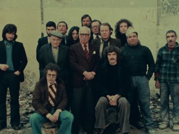 Movie still from “Women Reply” (1975), directed by Agnès Varda – A group of people posing for a picture; Wide shot, High angle