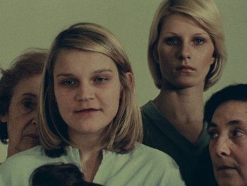 Movie still from “Women Reply” (1975), directed by Agnès Varda – A group of women standing next to each other; Close Up shot, Low angle