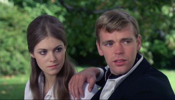 Movie still from “Women in Love” (1969), directed by Ken Russell – A man and a woman posing for a picture; Close Up shot, Over the shoulder angle