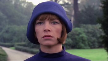 Movie still from “Women in Love” (1969), directed by Ken Russell – A person wearing a hat; Close Up shot, Low angle