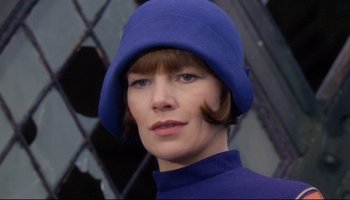 Movie still from “Women in Love” (1969), directed by Ken Russell – A person wearing a hat; Close Up shot, Low angle