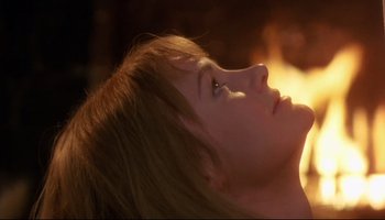 Movie still from “Women in Love” (1969), directed by Ken Russell – A woman's face in the sunlight; Close Up shot, Over the shoulder angle