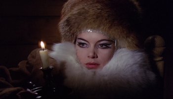 Movie still from “Women in Love” (1969), directed by Ken Russell – A person wearing a hat and fur; Close Up shot, Low angle