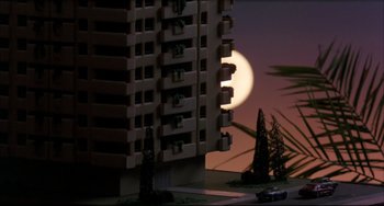 Movie still from “Women on the Verge of a Nervous Breakdown” (1988), directed by Pedro Almodóvar – A building that has a full moon in the background; Extreme Wide shot, Low angle