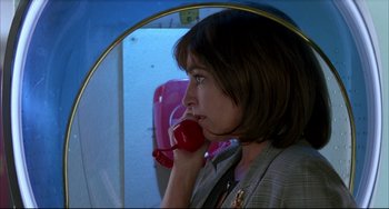 Movie still from “Women on the Verge of a Nervous Breakdown” (1988), directed by Pedro Almodóvar – A woman holding a red phone up to her ear; Close Up shot, Low angle