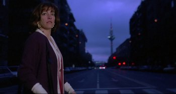 Movie still from “Women on the Verge of a Nervous Breakdown” (1988), directed by Pedro Almodóvar – A woman standing on the side of a road at night; Medium shot, Low angle