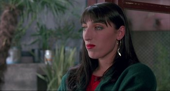 Movie still from “Women on the Verge of a Nervous Breakdown” (1988), directed by Pedro Almodóvar – A person with long black hair; Close Up shot, High angle