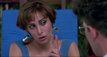 Movie still from “Women on the Verge of a Nervous Breakdown” (1988), directed by Pedro Almodóvar – A person sitting on a chair; Close Up shot, Over the shoulder angle