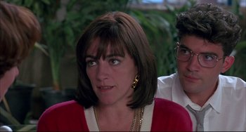 Movie still from “Women on the Verge of a Nervous Breakdown” (1988), directed by Pedro Almodóvar – A person wearing a red shirt; Close Up shot, Over the shoulder angle