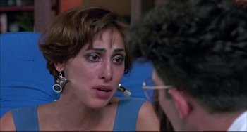 Movie still from “Women on the Verge of a Nervous Breakdown” (1988), directed by Pedro Almodóvar – A woman is crying while talking to a man; Close Up shot, Over the shoulder angle