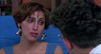 Movie still from “Women on the Verge of a Nervous Breakdown” (1988), directed by Pedro Almodóvar – A woman crying in front of a mirror; Close Up shot, Over the shoulder angle