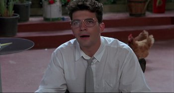 Movie still from “Women on the Verge of a Nervous Breakdown” (1988), directed by Pedro Almodóvar – A man in a white dress shirt and a tie; Close Up shot, Low angle