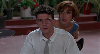 Movie still from “Women on the Verge of a Nervous Breakdown” (1988), directed by Pedro Almodóvar – A man and a woman are looking at the camera; Medium shot, Low angle