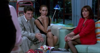 Movie still from “Women on the Verge of a Nervous Breakdown” (1988), directed by Pedro Almodóvar – A group of people sitting on top of a couch; Medium shot, High angle